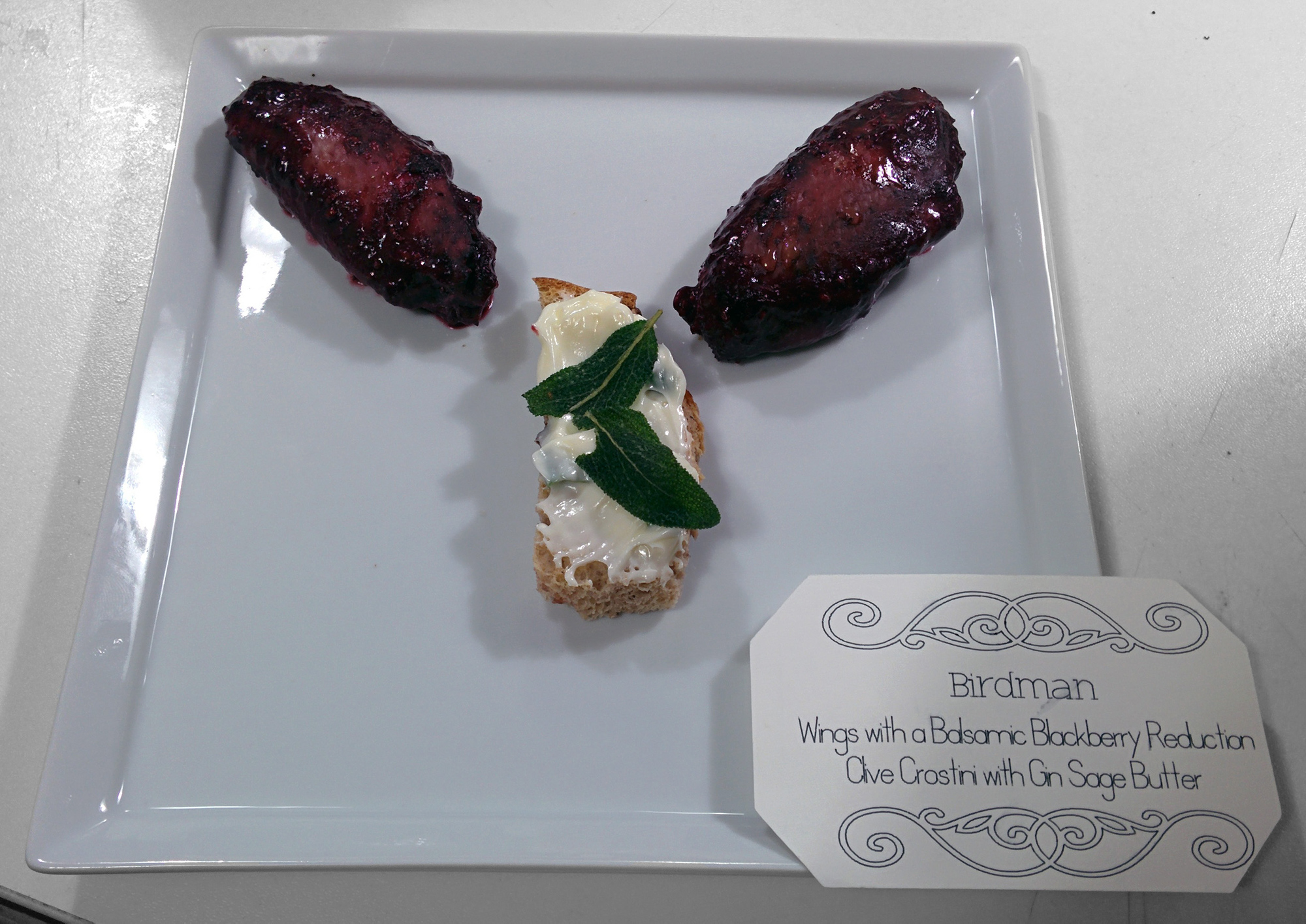 Birdman: Wings with balsamic blackberry reduction, olive crostini with gin sage butter