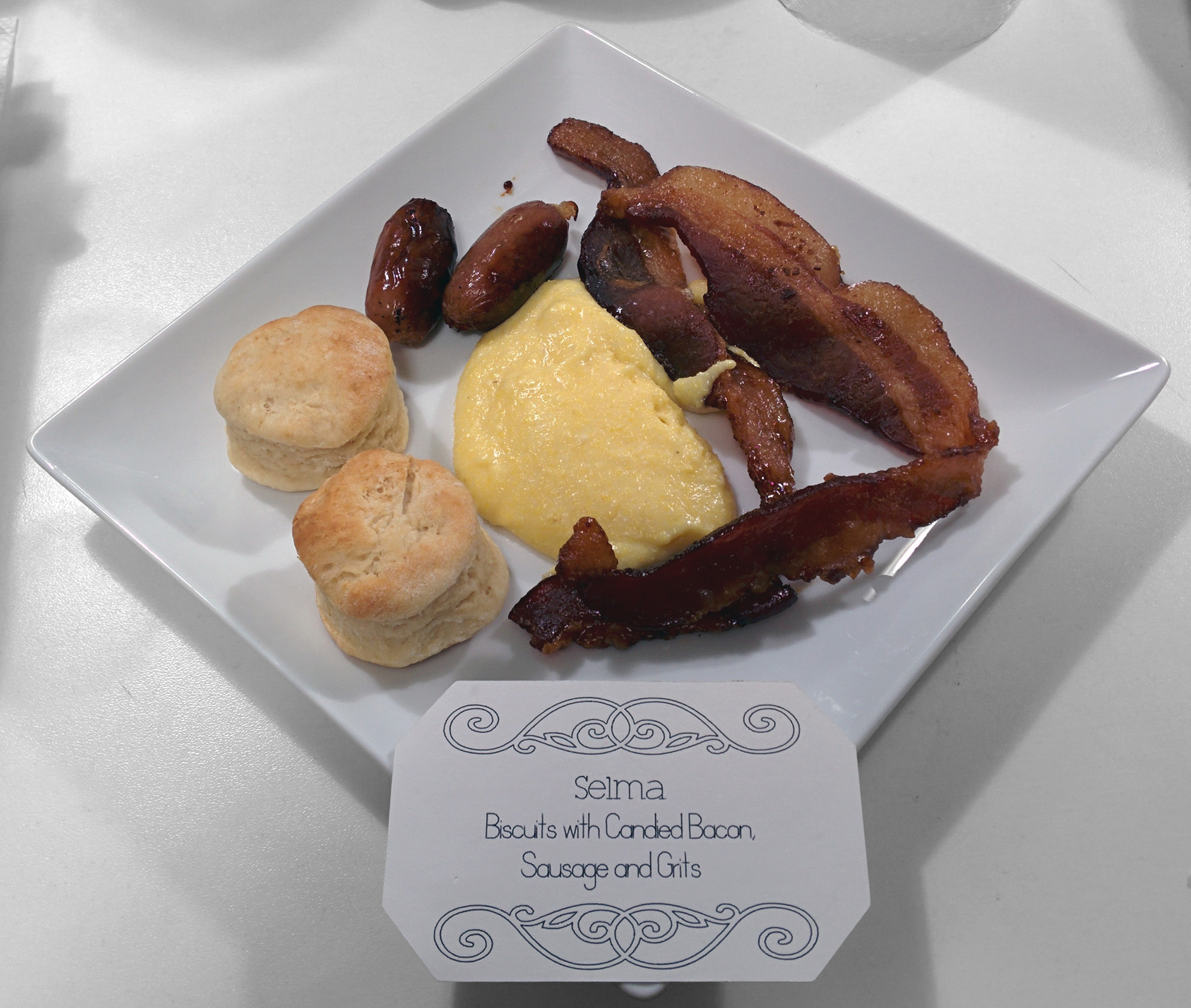 Selma: Biscuits with candied bacon, sausage, and grits